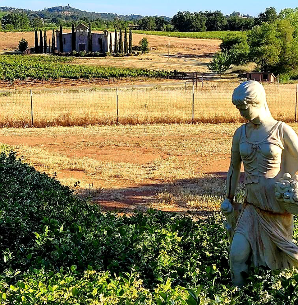 Photo of statue and winery building